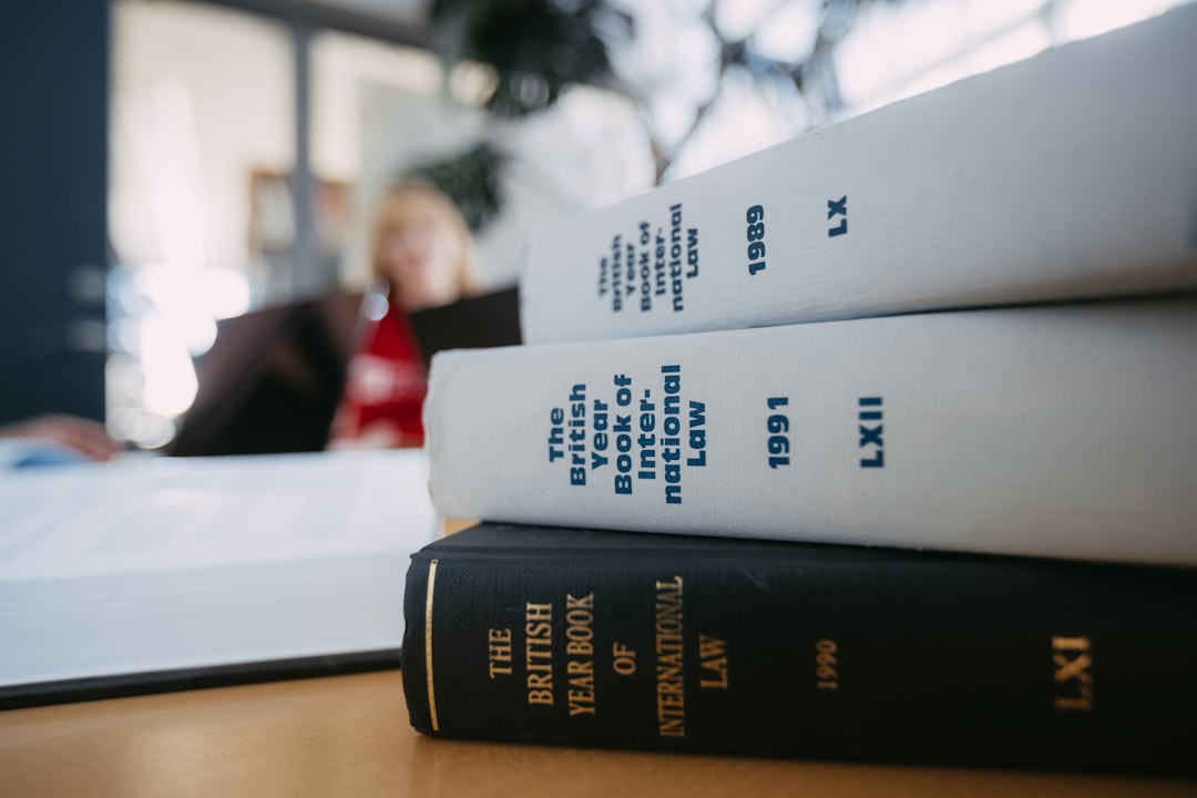 inmate rights — Legal books are stacked on a desk.
